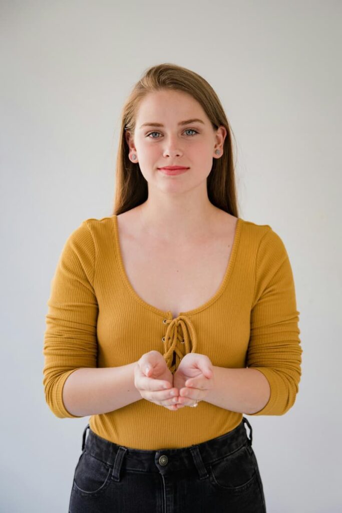 Image of a woman with open palms representing receiving through manifestation methods.