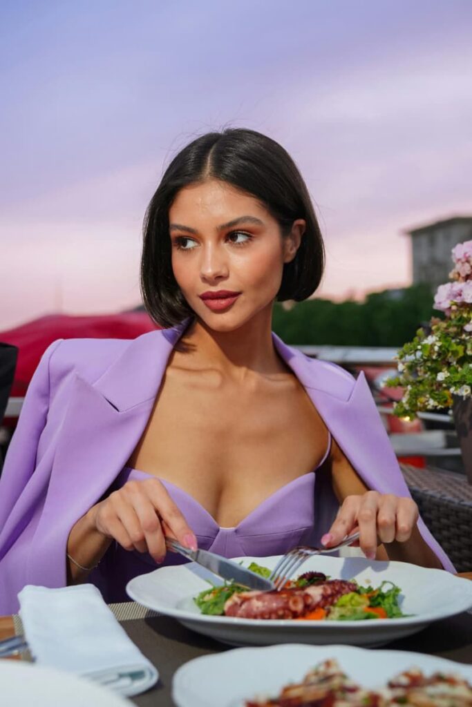 Woman on a solo restaurant date practicing the virtue of self-discovery.