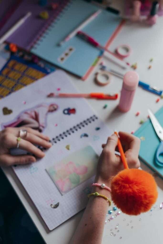 Image of a woman making a colorful journal spread.